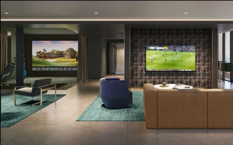 a room with a large screen and chairs