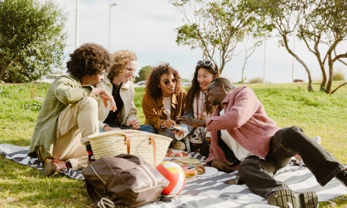 Friends having a picnic outdoors